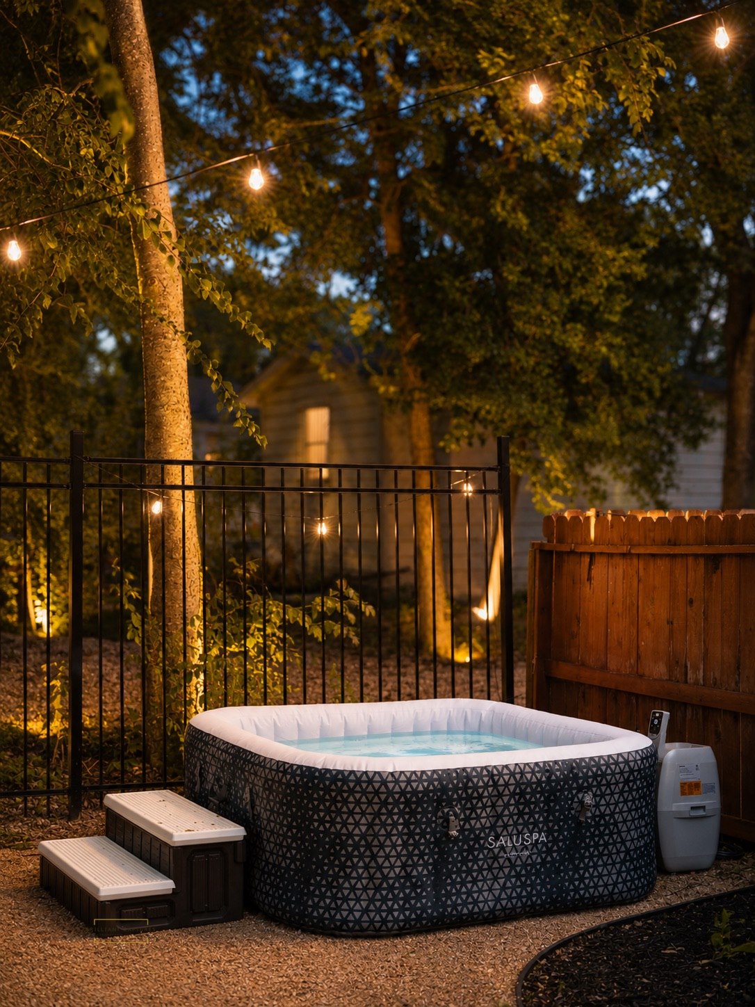 Outdoor spa and string-lit backyard lounge at The Urban Casa