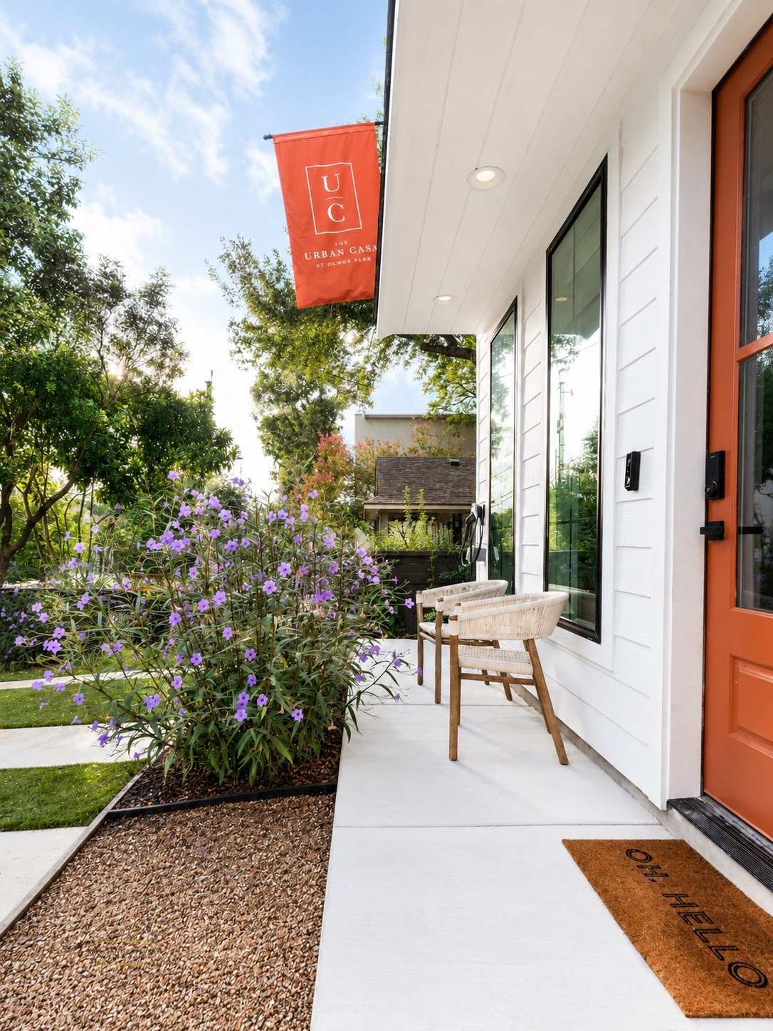 Softly lit front porch and entry at The Urban Casa